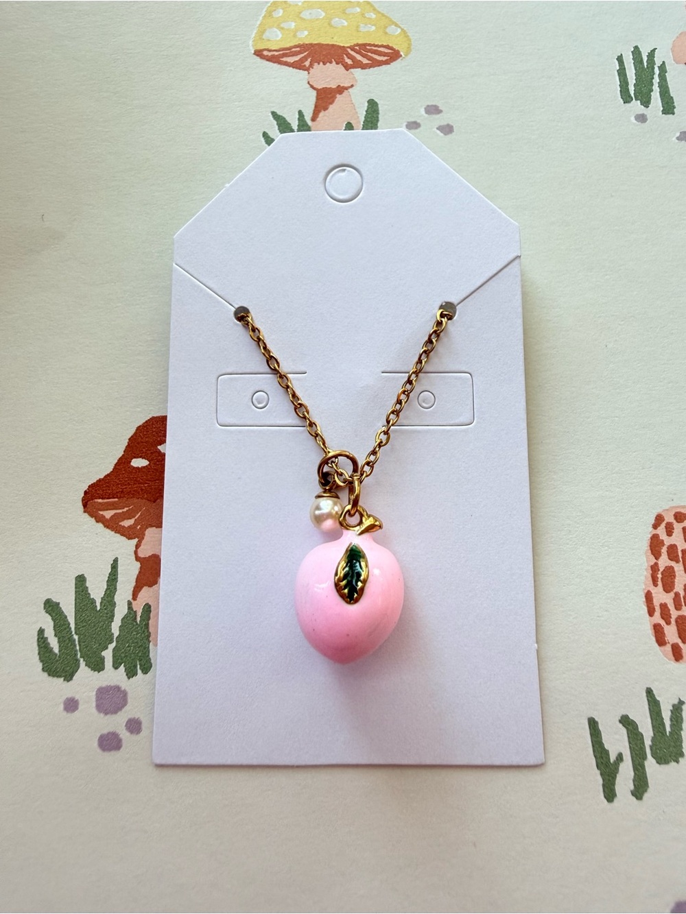 Gold-Tone Necklace with Peach Pendant, Green Leaf and Pearl Accent
